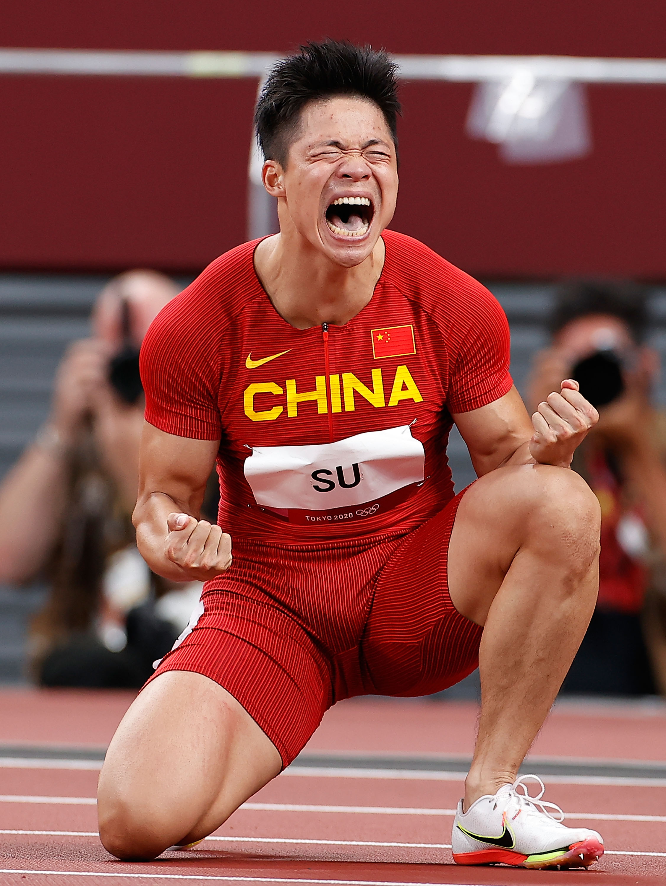 蘇炳添在比賽后慶祝,。